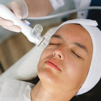 A doctor performing breakthrough light therapy treatments for dry and irritated eyes on a patient